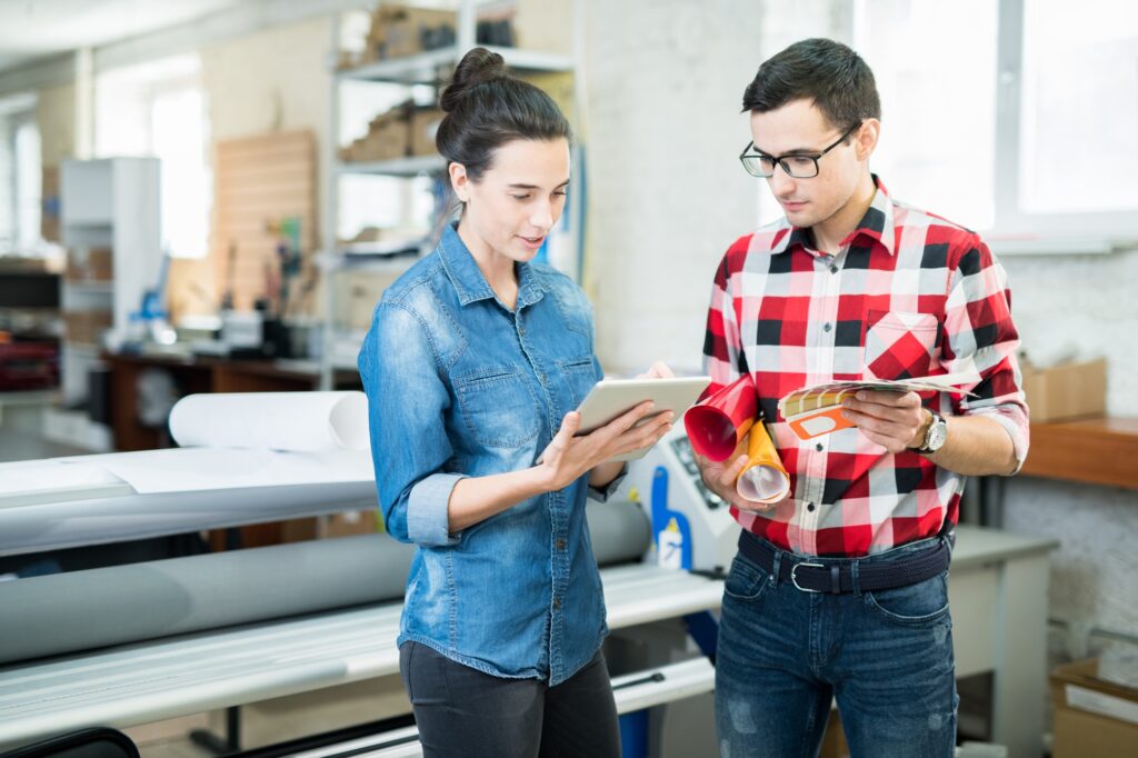 Printing experts discussing design and paper